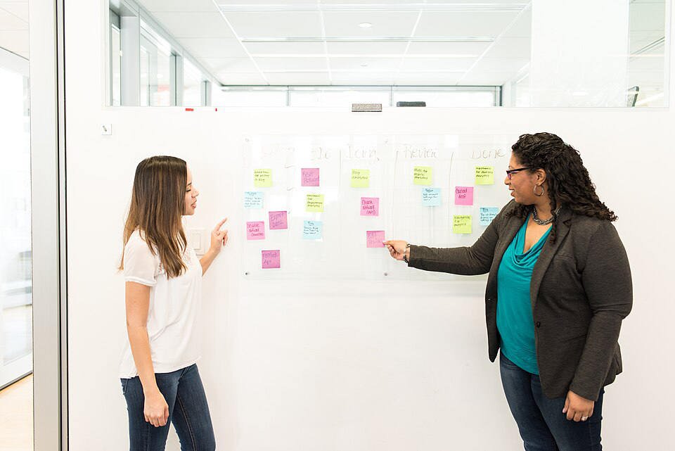 Consultants reviewing a management framework with a client team